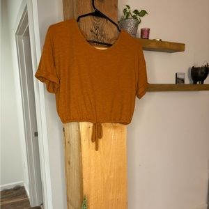 Burnt orange, and blue women’s open back casual crop tops.